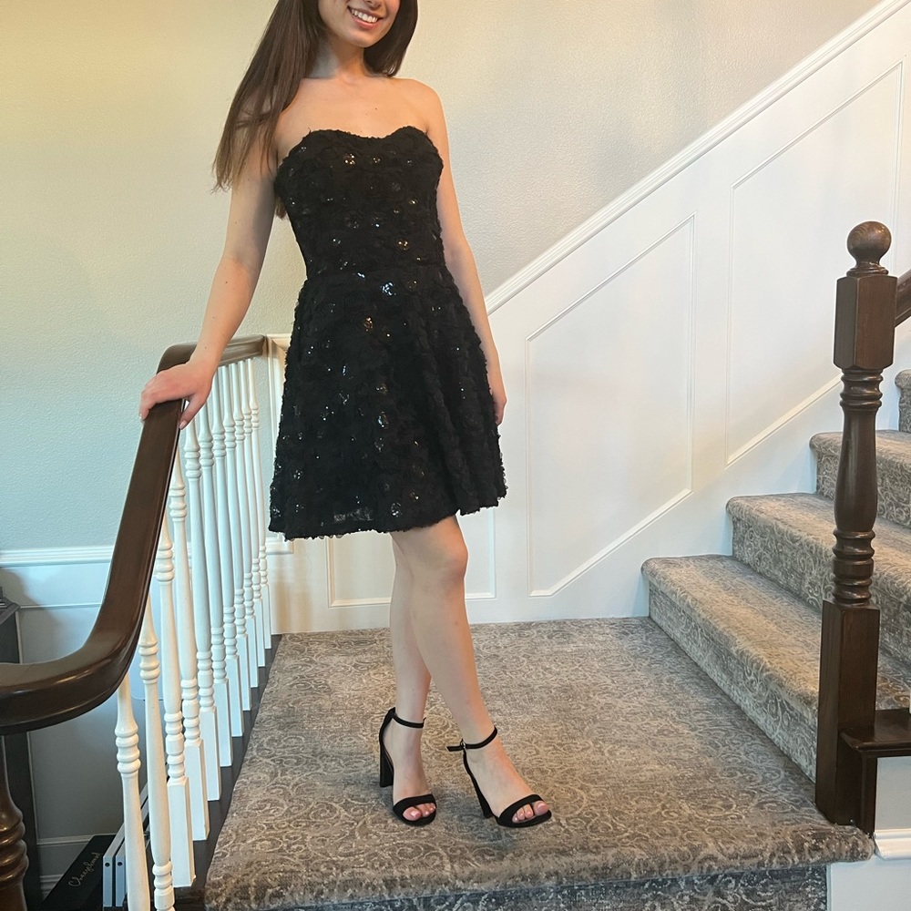 Gorgeous strapless, corset, Bebe black mini dress.